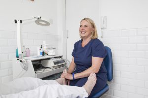 Victoria Wilson smiling during work at Beauchamp Foot Care